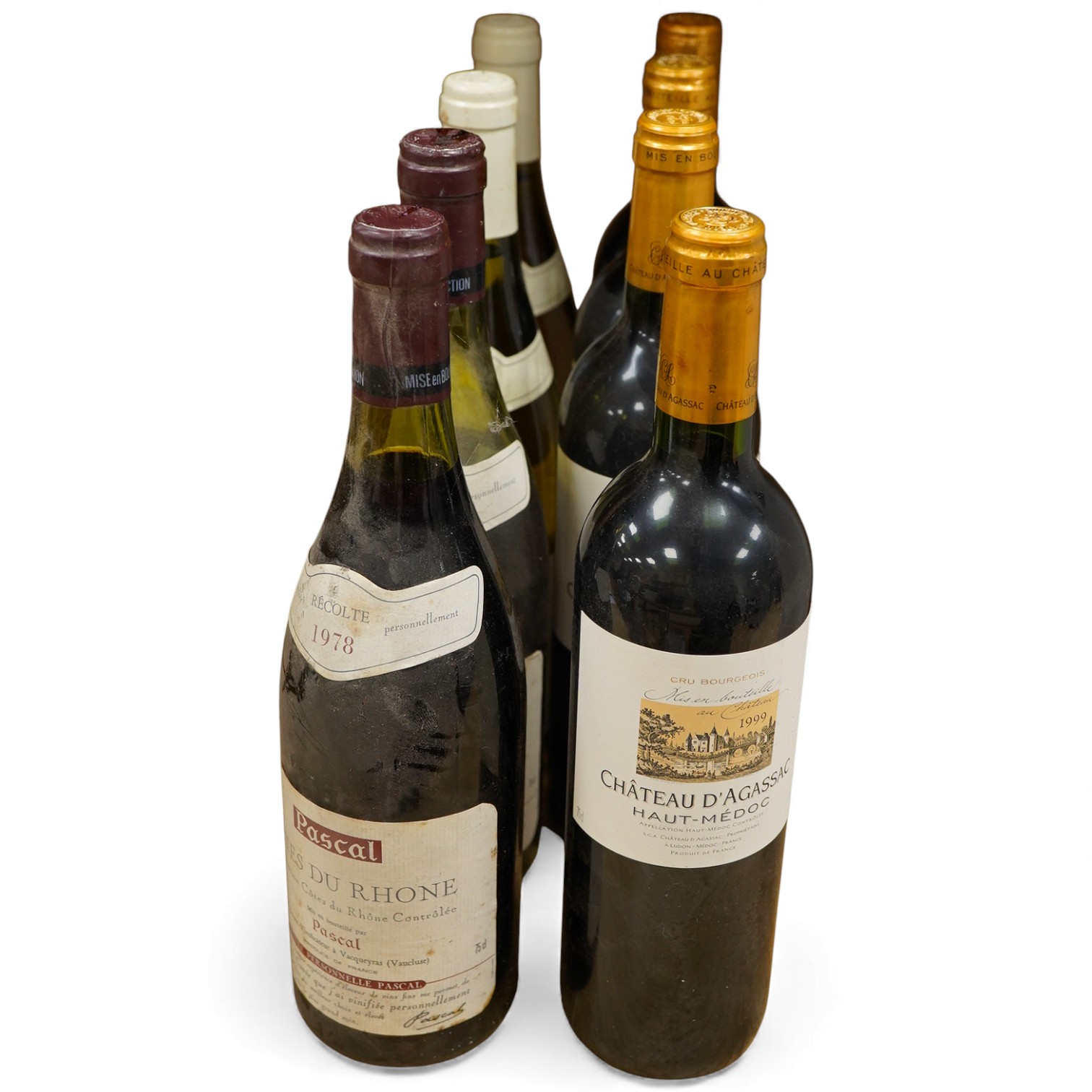 Eight bottles of wine; Chateau d’Agassac 1999, four bottles, Puligny-Montrachet 2002, two bottles, Côtes du Rhône 1978, two bottles